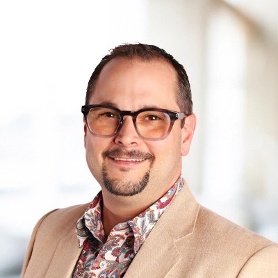 A headshot of Dr. Cameron Roe, a chiropractor at Anna Disc Center.